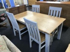 A matching As New extending table with four chairs