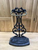 A cast iron and brass stick stand