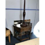 An oak single drawer side table and a mahogany standard lamp