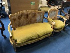 A Bergere single canework two seater walnut settee and a single armchair