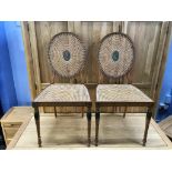 A fine pair of 20th century decorative satinwood single chairs, with oval canework backs and seats