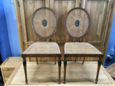 A fine pair of 20th century decorative satinwood single chairs, with oval canework backs and seats
