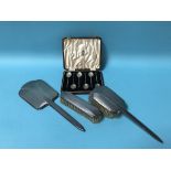 A Deco silver part brush set and a set of six silver coffee spoons