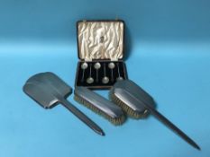 A Deco silver part brush set and a set of six silver coffee spoons