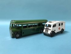 A Tri-ang Minic Push and Go Bus and a clockwork Ambulance
