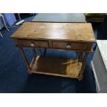 A pine two drawer side table, 90cm wide