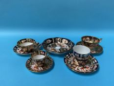 A Royal Crown Derby circular dish, three Imari pattern cups and saucers and one other