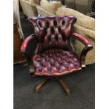 A Chesterfield oxblood office swivel chair