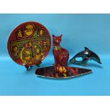 A Poole pottery cat, 29cm high, a Dolphin and a Poole charger, 24cm diameter and Poole Spear dish (