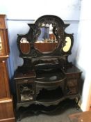 A Victorian mirror back side cabinet