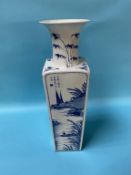 A tall tapering square Chinese blue and white vase, each side decorated with landscape scenes, marks