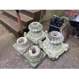 Two composite garden urns and a chimney pot