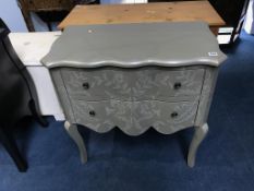 A grey decorative bombe two drawer chest of drawers, 76cm wide