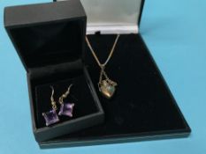 A 9ct gold chain and yellow metal pendant and a pair of earrings