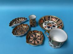 A Derby Imari coffee can and saucer, a Royal Crown Derby miniature vase and three pin dishes