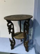 A carved two tier table