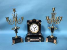 A slate mantle clock and garniture