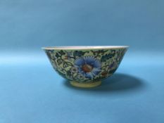 A Chinese famille rose bowl, on yellow ground, 15cm diameter
