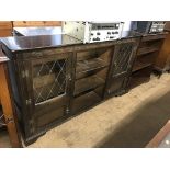 An oak bookcase and a display cabinet