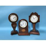 An Edwardian mahogany balloon clock and two others (3)