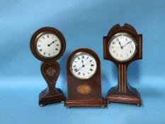 An Edwardian mahogany balloon clock and two others (3)