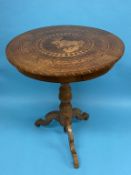 A 19th Century Italian walnut Sorrento circular top tripod table, with parquetry and marquetry