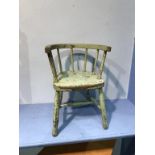 A pair of green painted child's chairs