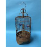 An Oriental bamboo bird cage