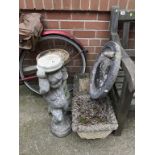 Two planters, a bird bath etc.