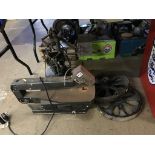 A scroll saw, cast wheels etc.