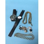 A bag of assorted costume jewellery and watches