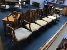 A set of six reproduction Hepplewhite style dining chairs