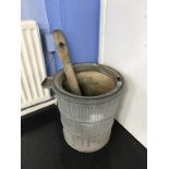 A galvanised poss tub and stick