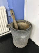 A galvanised poss tub and stick
