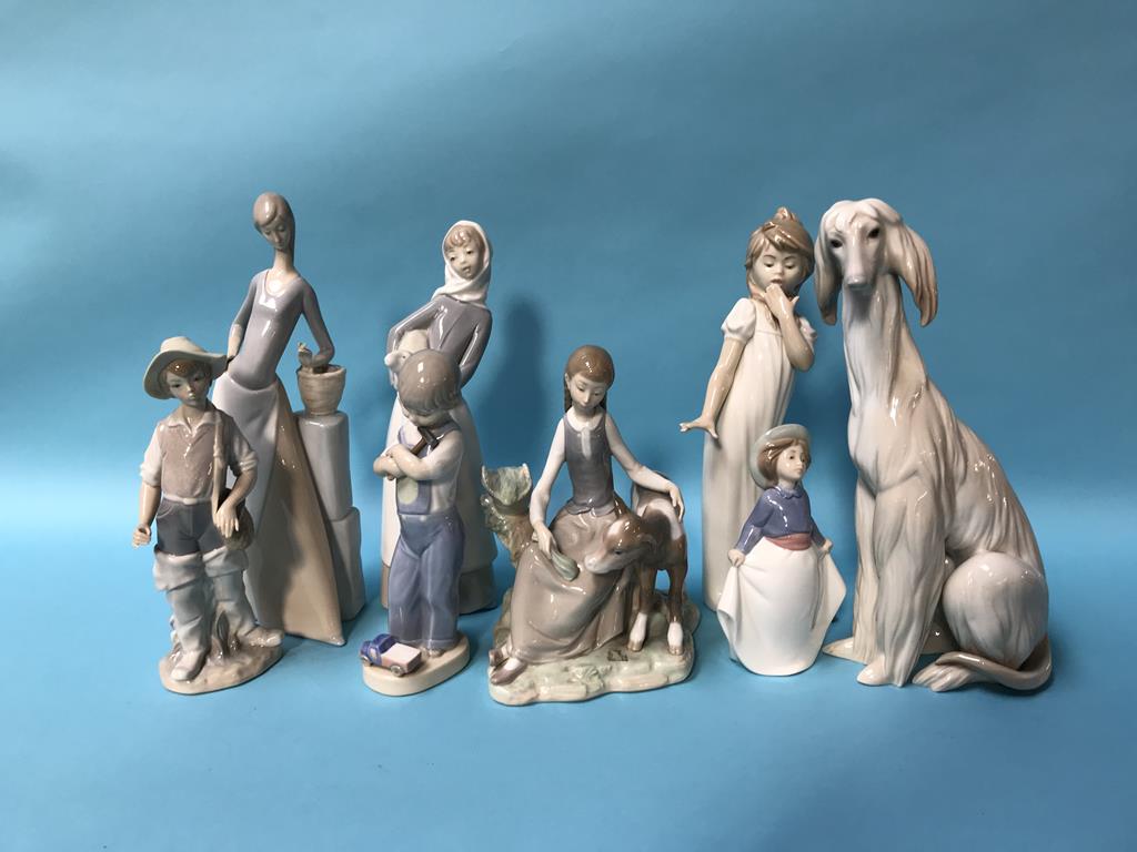 A collection of Lladro and Nao figures (8)