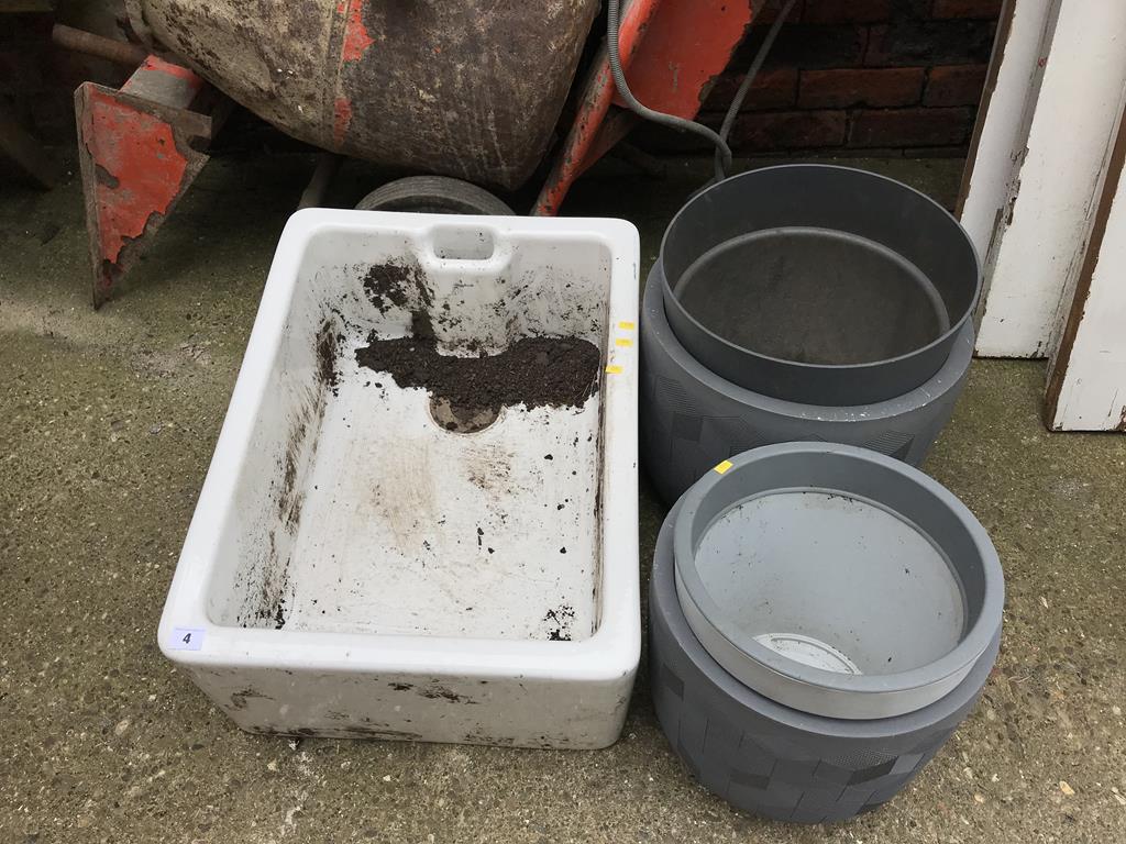 A Belfast sink and two planters