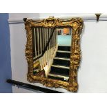 An ornate gilt mirror, 61 x 51cm