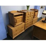 A pine chest of drawers, pair of bedside cabinets and a pair of bedside chests