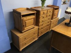 A pine chest of drawers, pair of bedside cabinets and a pair of bedside chests
