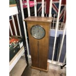 An oak cased clock