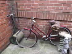 A Vintage cycle and a garden roller