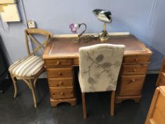A pine pedestal desk and two chairs