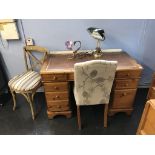 A pine pedestal desk and two chairs