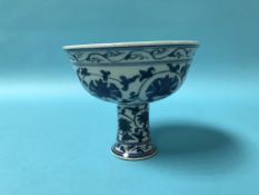 A Chinese blue and white stem cup, with marks in underglaze blue, 10cm height