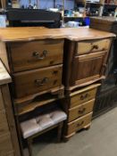 A pine dressing table and two pine bedside drawers