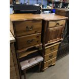 A pine dressing table and two pine bedside drawers