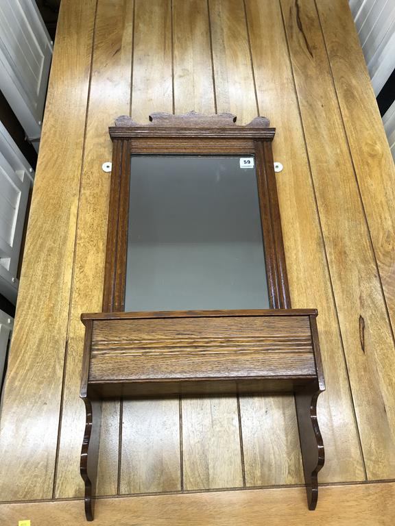 An oak mirror wall shelf