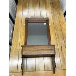 An oak mirror wall shelf