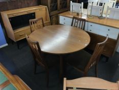 A G Plan teak circular dining table with four chairs