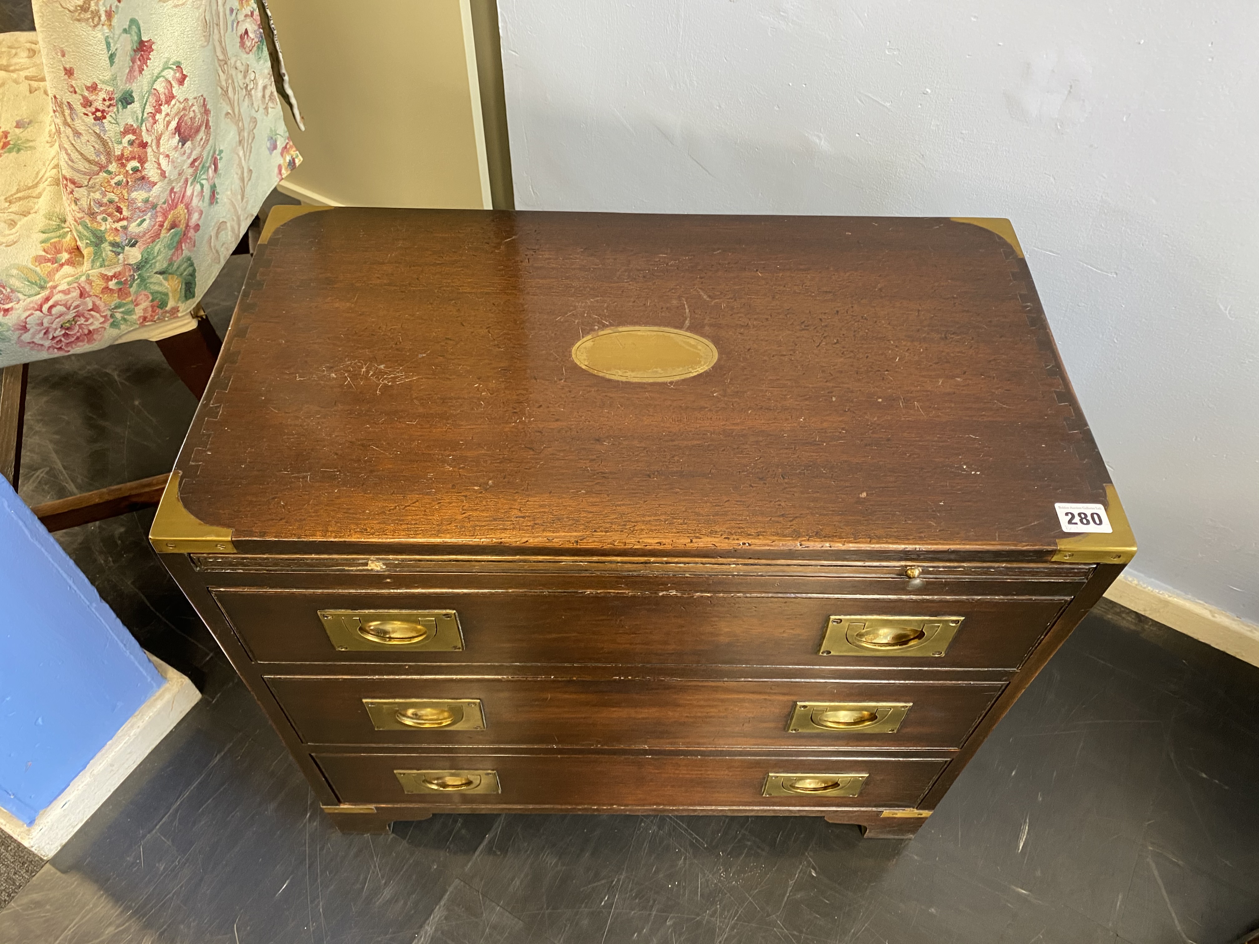 A reproduction mahogany campaign style chest of three drawers, with brushing slide, 61cm wide - Image 6 of 8